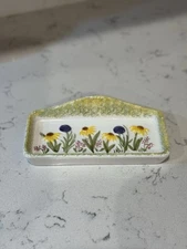 Hand-painted ceramic dish with floral motif and speckled glaze Unmarked