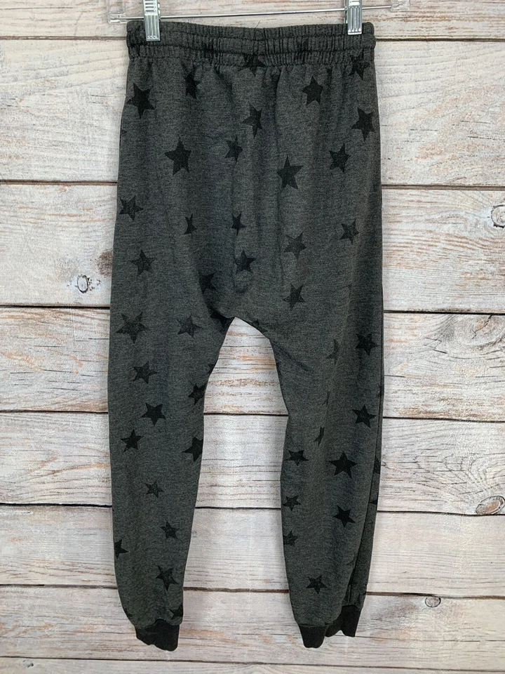 Joggers Kind is Cool Gris/Negro Estampado de Estrellas Entrepierna Caída Usados en Excelente Condición Para Niñas Talla XL Foto 2 de 4