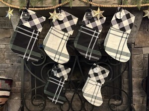 Set Of Six Buffalo Plaid Stockings With “Believe” Charms
