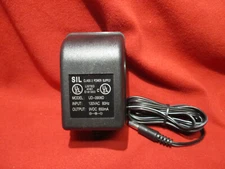 AC DC Power Adapter  Input:120V AC 60Hz to Output:9 V DC 600mA center negative