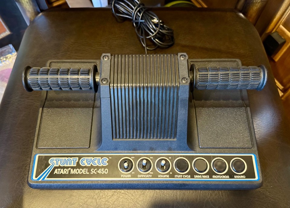 The Atari Stunt Cycle is a wildly obscure 1977 dedicated console with a motorcycle throttle controller — pure retro conversation-starter.