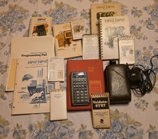 HP-67 calculator with Pouch, plug, accessories and programs and template sheets