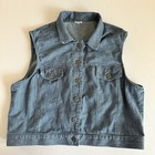 Vintage blue cotton denim vest XL with front snap buttons, pointed collar, and two front flap pockets made in USA.