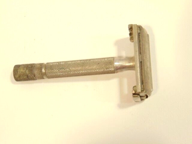 older Gillette safety razor;  marked X-4 on back of shaving head