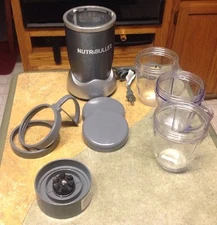 Nutribullet Magicbullet Blender Includes 3 - 20 Oz Cups , 9 pieces total*