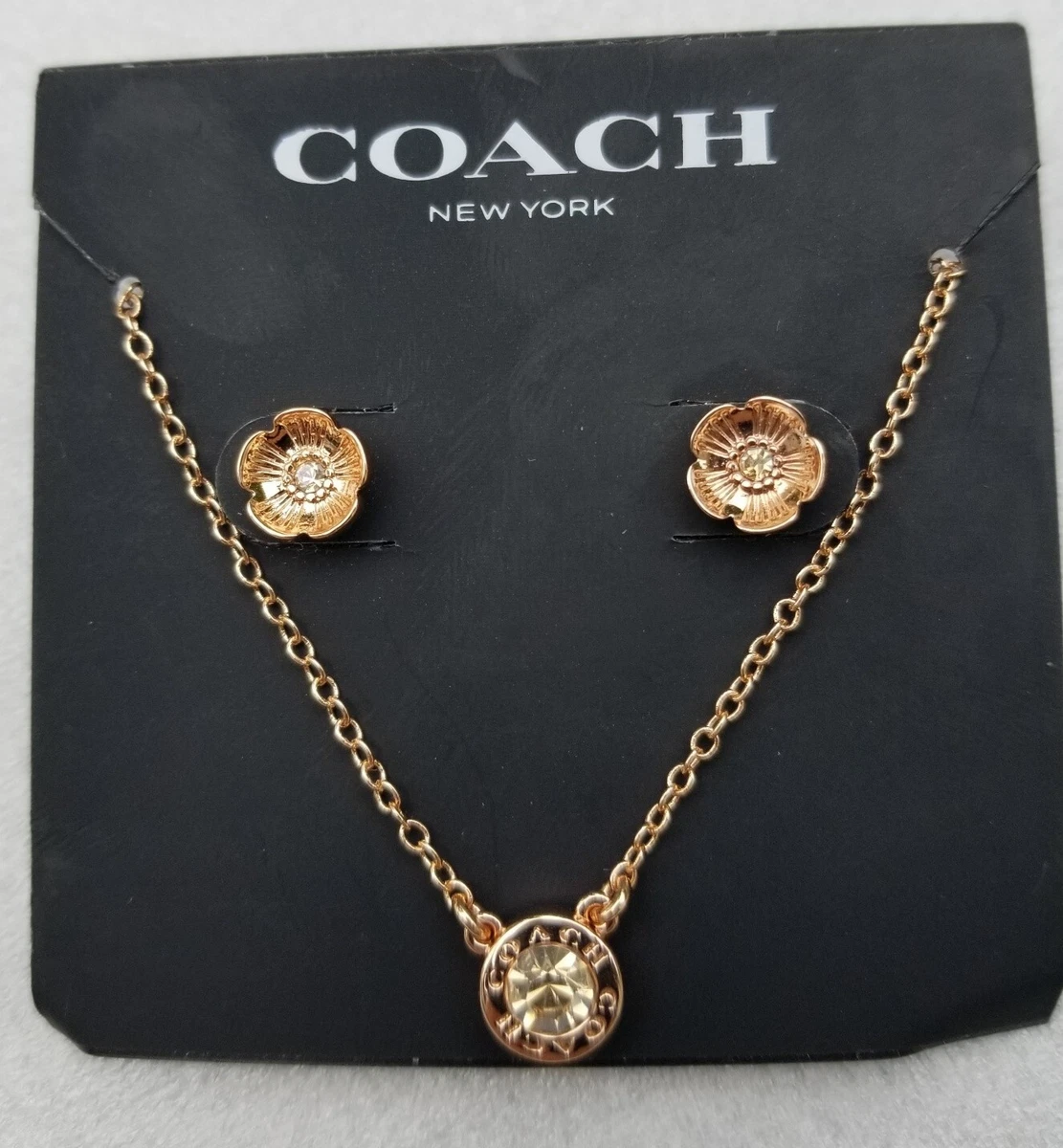 Coach necklace rose best sale gold
