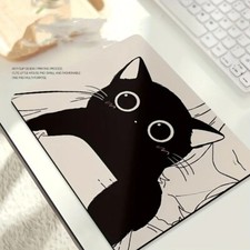 A small mouse pad with a black cat on it.