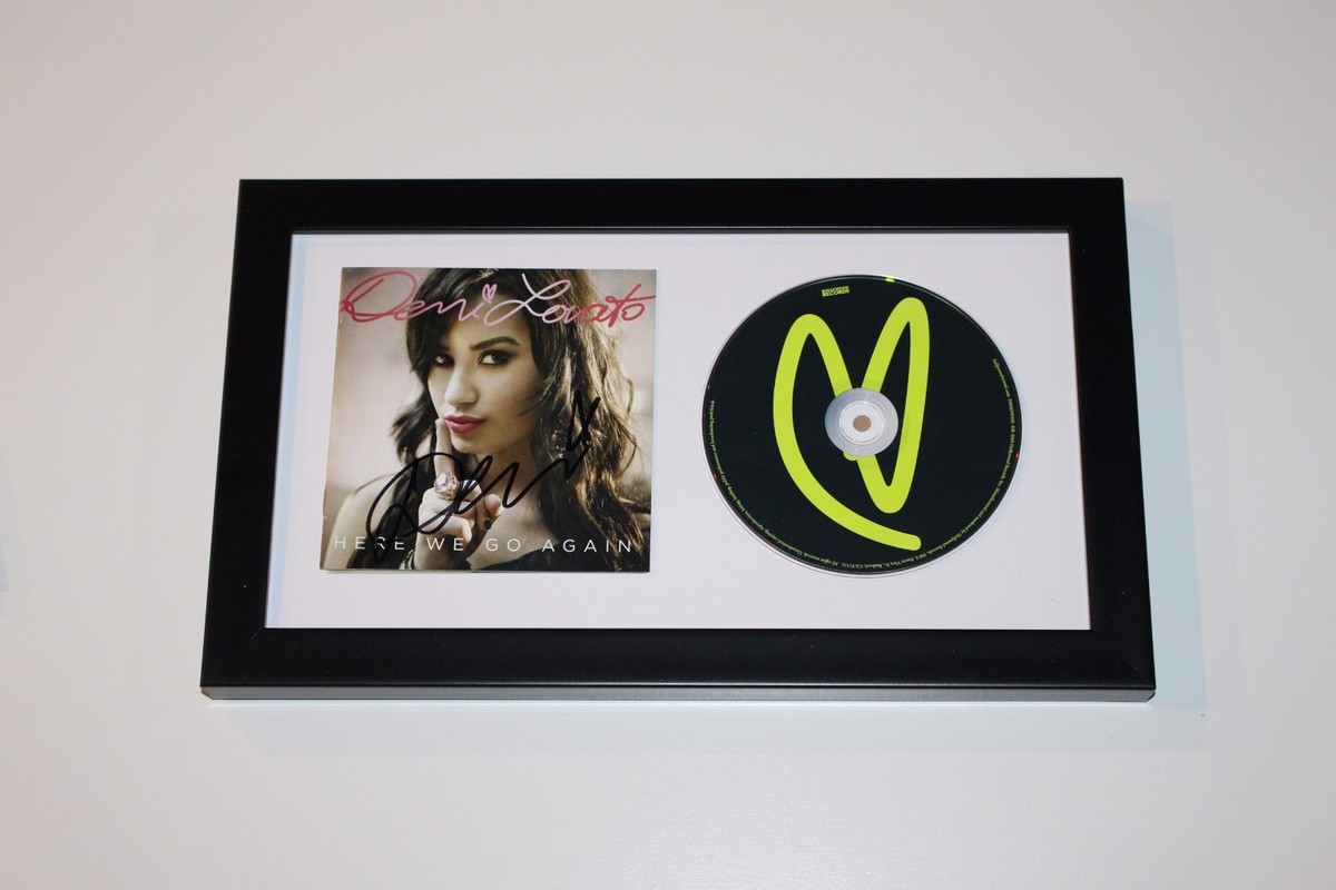 SINGER DEMI LOVATO SIGNED FRAMED 'HERE WE GO AGAIN' CD COVER