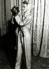 WWII Britain A woman wearing a siren suit with her gas mask Old Photo