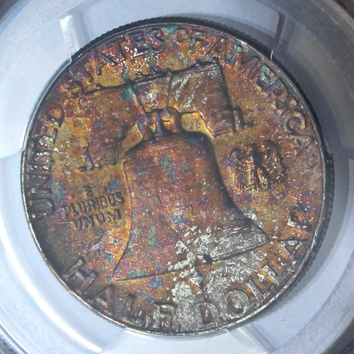 Spotty Rainbow Toned 1957 Franklin Half Dollar PCGS MS65 Silver 50c Coin