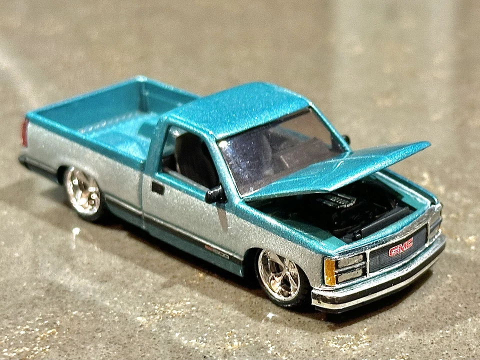 M2 Machines 1989 GMC Sierra 1500 LT4 Custom Lowered Teal x Silver TWO-TONE 1:64 - Image 4 of 4