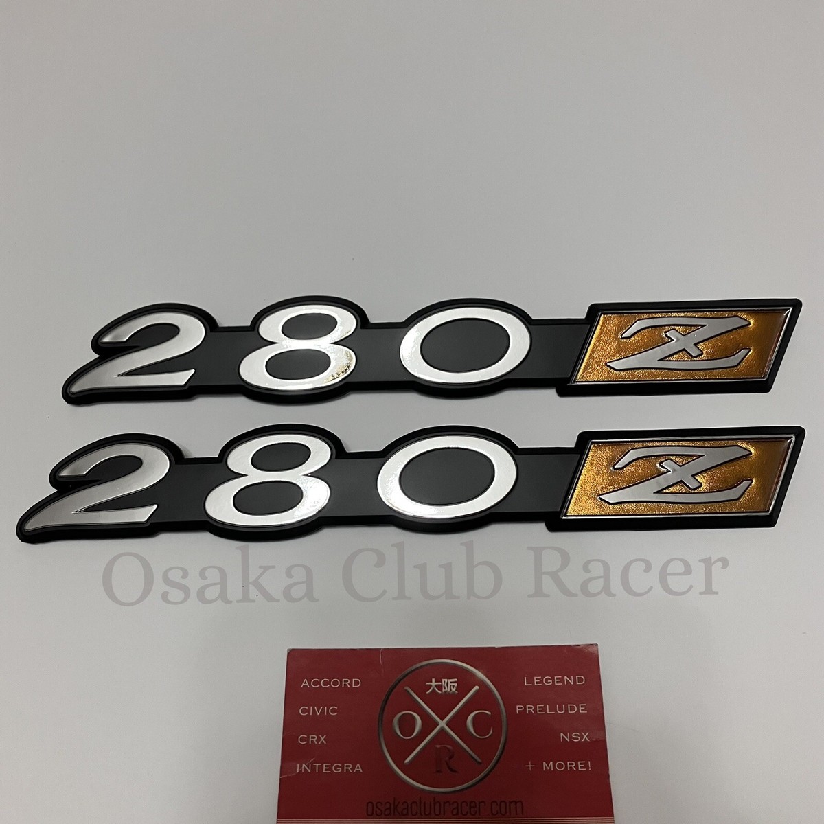 New Genuine OEM 1975-78 Datsun 280Z Fender Emblem Badge Set New Genuine OEM 1975-78 Datsun 280Z Fender Emblem Badge Set