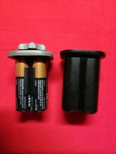 Battery Storage Container. 4 AA Batteries. Batteries not included.