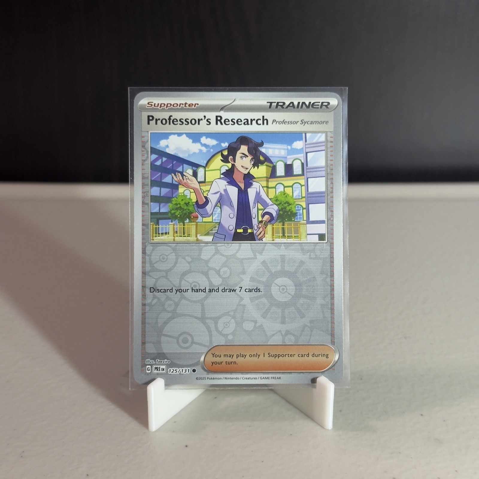 Professor’s Research 125/131 Reverse Holo Prismatic Evolutions Pokemon TCG - NM