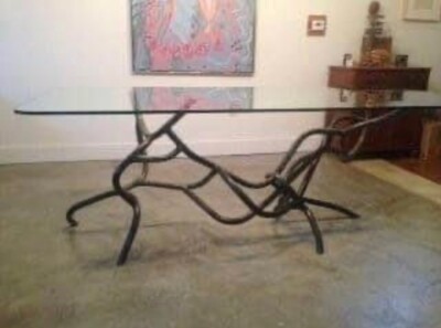 Unique, hand-made dining table, glass top, industrial piping base by Ohio artist