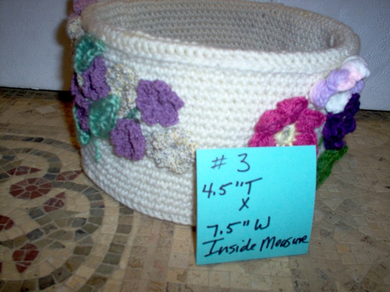 Handcrafted/crochet flower/planter. off  white  with flowers