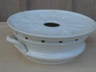 old white earthenware flat heater, centerpiece, under...
