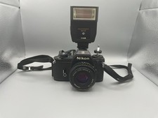 Nikon EM 35mm Film Camera with 50mm f/1.8 Lens and Quantaray Flash Untested