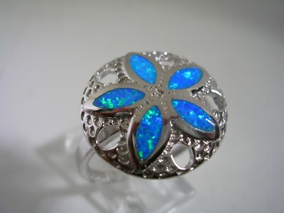 SAND DOLLAR RING WITH OPALS AND A HIGH POLISHED FINISH SET STERLING SILVER 