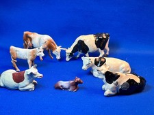 Group 7 British Metal Cows and Calves, 3 Standing, 4 Sitting, 1 is FGT  Sons