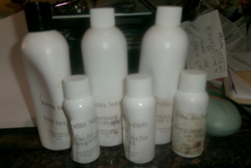 3 8 oz bottles of kandila supply fragrance oil and 3 2 oz bottles