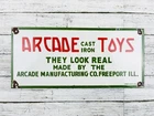 VINTAGE ARCADE CAST IRON TOYS 10x4.5" PORCELAIN METAL GASOLINE GAS OIL TOY SIGN