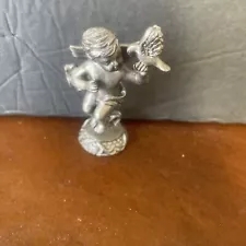 vintage pewter winged angel with bird figure 