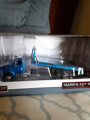 NIB 1/64 Blue International IH 8600 Rollback Tow Truck SpecCast | eBay