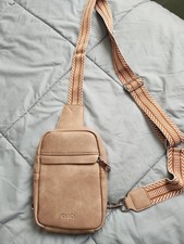 brown CLUCI vegan leather sling bag with a patterned strap
