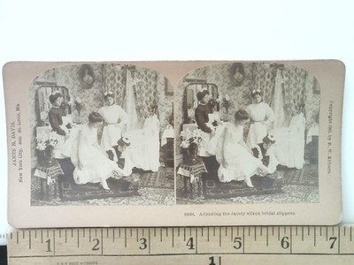 Adjusting the dainty silken bridal slippers Stereoview B.W. Kilburn No. 16658