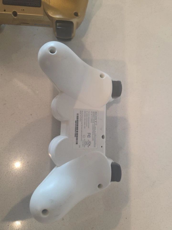 2 controladores originales OEM Sony Playstation 3 CECHZC2U PS3 DualShock 3 - dorado/blanco Foto 4 de 4