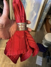 very sweet round vintage napkin ring, pierced with rolled silver edge