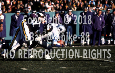 MATT BLAIR,JEFF SIEMON MINNESOTA VIKINGS VS. DETROIT LIONS DEXTER BUSSEY 1976