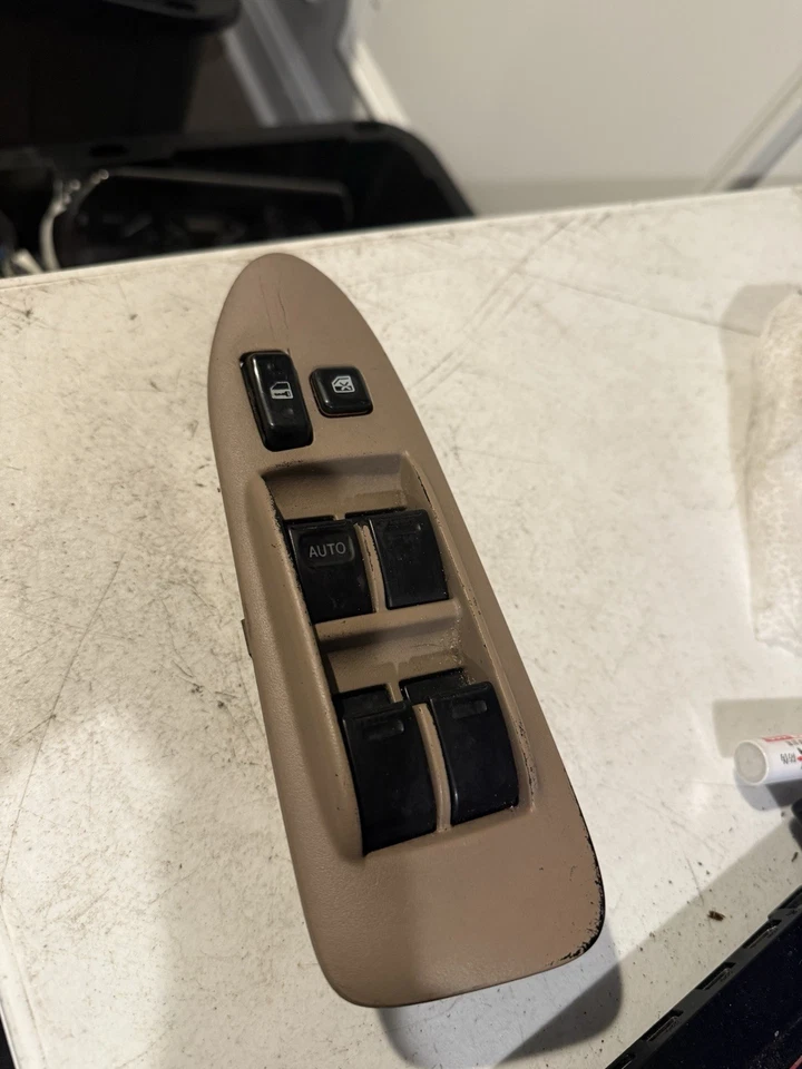 Toyota Camry LE 1997-2001 interruptor de bloqueo de ventana maestra del conductor izquierdo con bisel bronceado Foto 2 de 4