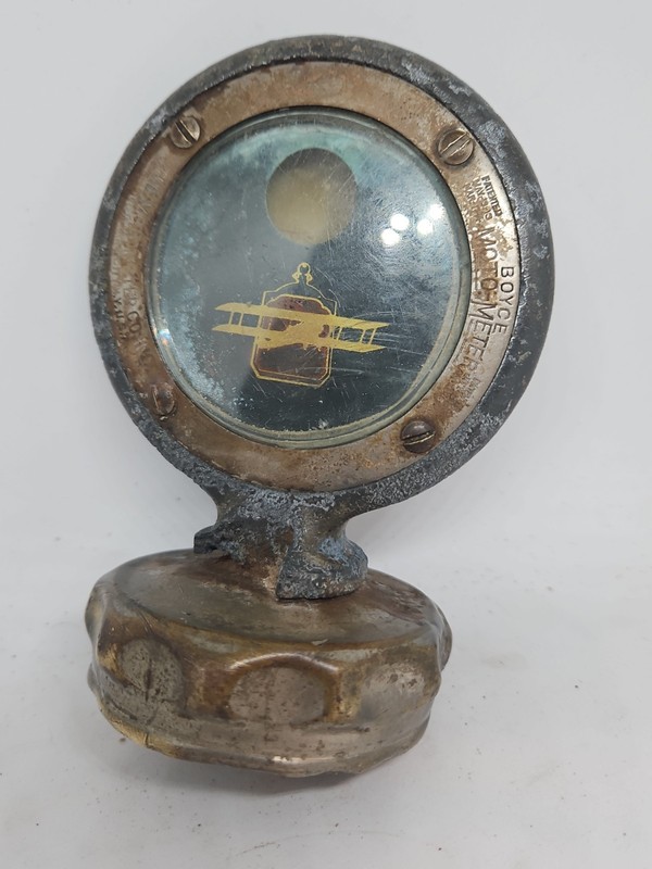 Beveled glass Boyce Motometer radiator cap with airplane logo Circa 1915