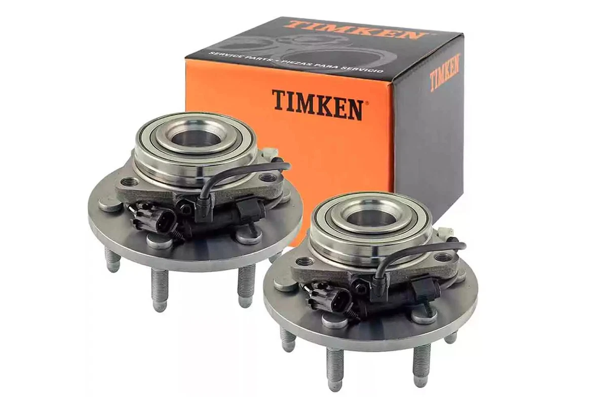 A pair of TIMKEN front hubs for General Motors 1500 trucks, displayed with packaging on a white background.