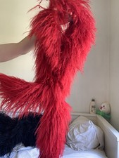 Voluminous red mongolian curly wool statement scarf with pull-through loop
