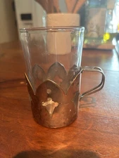 cup with silver plate holder marked EMBE 4 two separate pieces