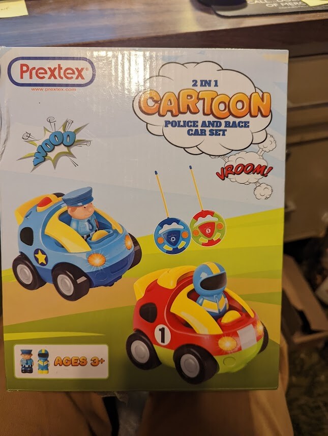 PREXTEX RADIO CONTROLLED 2 IN 1 CARTOON POLICE AND RACE CAR SET, W/ 2-FIGURES