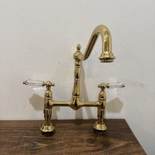 Kingston Brass Heritage Bridge Kitchen Faucet, Polished Brass - Clear Handles