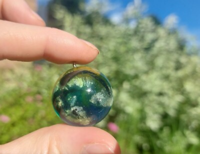 Parachute gliding in the cloudy sky pendant/necklace