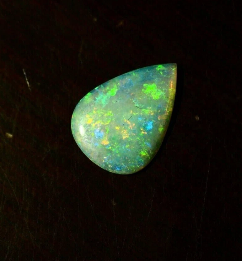 Ópalo australiano Lightning Ridge sólido de 3,22 quilates 18 x 13 x 2,4 mm Foto 3 de 4