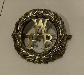 A Brass W.F.B. Fire Helmet/Cap Badge.