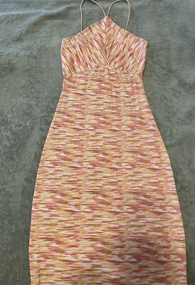 Elegant knit dress with a blend of pink, orange, and cream hues.