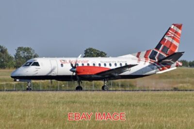 FOTO FLUGZEUG SAAB 340B 'G-LGNU' LOGANAIR C/N 223. BAUT 1990. SEEN ARRIVING