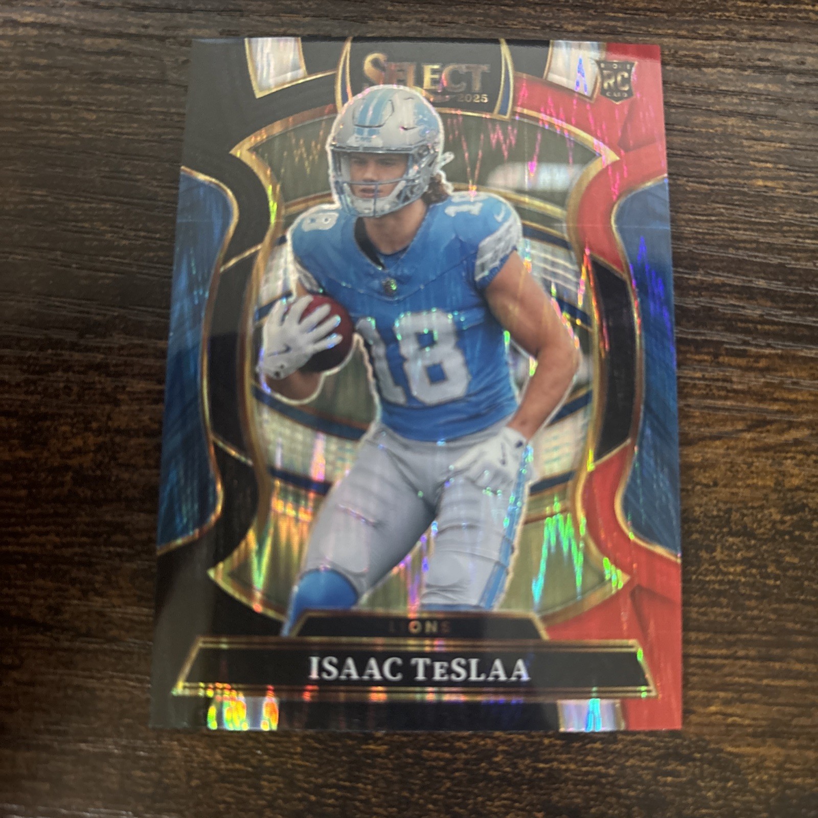 2025 Panini Select Concourse Red And Blue Prizm Shock Isaac TeSlaa Lions