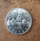 1959 uncirculated Canadian 80% silver dollar