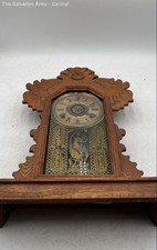 The E. Ingraham Co. Brown Wooden Decorative Mechanical Gingerbread Mantel Clock