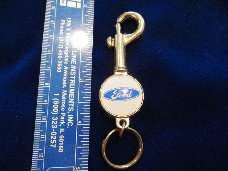 FORD BOTTLE CAP SHAPED KEY CHAIN WITH KEY RING, SPRING CLIP,  AND BOTTLE OPENER