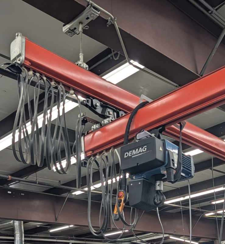 DEMAG DC-Com 5-500 Electric Chain Hoist w/ Rail System, hardware, material hoist